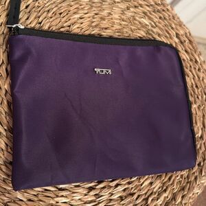TUMI purple mini travel accessories bag